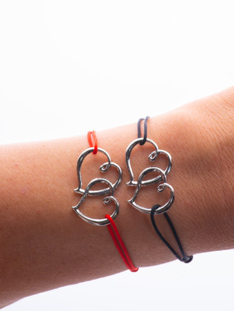 two pair bracelets are made of Korean rope and there is a love emblem that can be fused because there are magnets in it.の写真素材