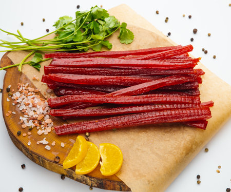 Smoke salmon on craft paper at wooden table. Tenderloin fish still life. Country meal.の写真素材