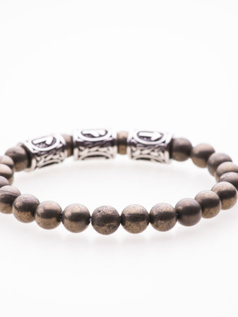 A charming double bracelet in shades of brown, made from natural stone. The bracelet features silver accents and stands out in this close-up top viewの写真素材