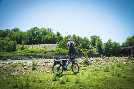 Cyclist with a mountain bike on the background of the forestの写真素材