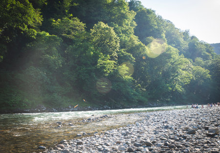 A small waterfall among the rocks on the mountain river in Georgia. Panoramic picture.の写真素材