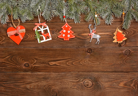 christmas tree with toys on a wooden backgroundの写真素材