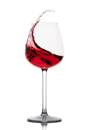 moving red wine glass over a white backgroundの写真素材