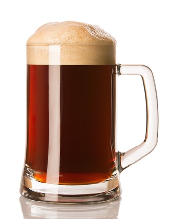dark beer in a glass, isolated on a white backgroundの写真素材