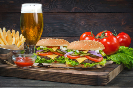 Hamburger and light beer on a pub background.の写真素材