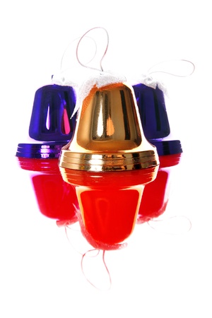 christmas bells with reflections isolated on whiteの写真素材
