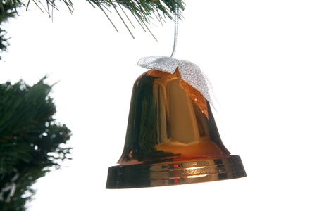 christmas bell in fir isolated on whiteの写真素材