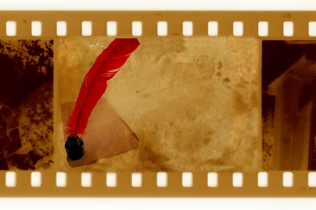 oldies 35mm frame photo with vintage inkwell and featherの写真素材