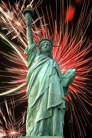 Statue of Liberty and fireworks in black skyの写真素材
