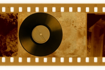 oldies 35mm frame photo with vintage vinyl diskの写真素材