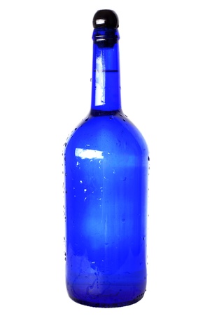 blue glass bottle with cap isolated on whiteの写真素材
