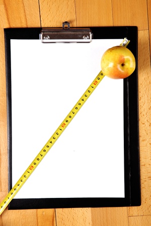 diet plan - blank clipboard with a measuring tape, apple and copy spaceの写真素材
