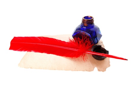 Antique red pen and inkwell at old paper isolated on whiteの写真素材