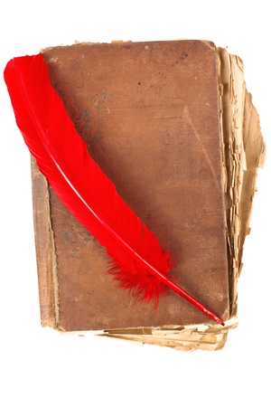 vintage book with red feather pen の写真素材