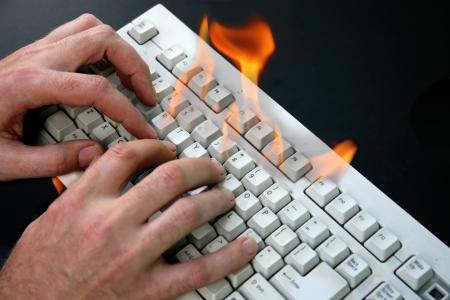 hand and burned keyboardの写真素材