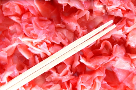 japanese fresh red ginger and wooden chopsticksの写真素材