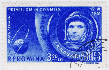ROMANIA - CIRCA 1961   stamp printed in Romania shows russian astronaut Yuri Gagarin first human in space, circa 1961のeditorial素材