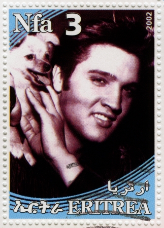 ERITREA - CIRCA 2002 : stamp printed in Eritrea shows famous rock and roll singer and actor Elvis Presley, circa 2002のeditorial素材