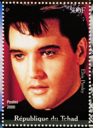 TCHAD - CIRCA 2000 : stamp printed in Tchad - famous actor and rock and roll singer Elvis Presley, circa 2000のeditorial素材