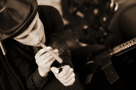 man in car with cigar and rifleの写真素材