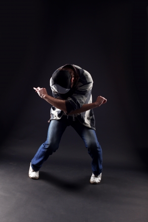 cool man modern dancer against blackの写真素材