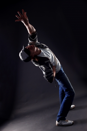 cool man modern dancer against blackの写真素材