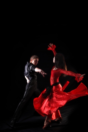 dancers in action against black backgroundの写真素材