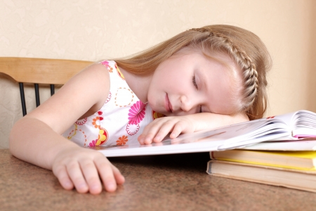 girl sleep at booksの写真素材