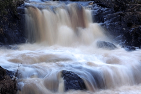 Faster waterfall running over rocks