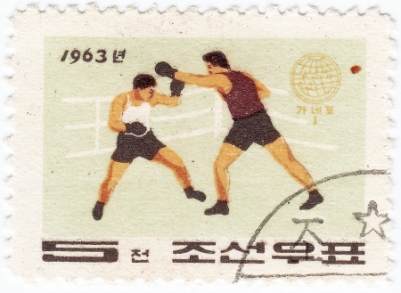 KOREA - CIRCA 1963 : post stamp printed in Korea shows sportsman boxer, circa  1963のeditorial素材
