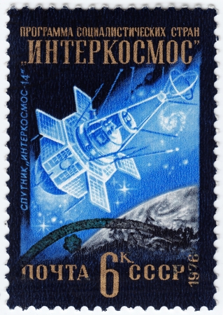 USSR - CIRCA 1976 : stamp printed in the USSR shows satellite Intercosmos-14, circa 1976 のeditorial素材