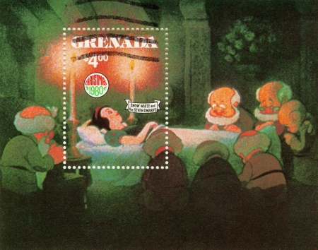 GRENADA - CIRCA 1980 : Christmas stamp printed in Grenada shows Snow White and The Seven Dwarfs cartoon, circa 1980のeditorial素材