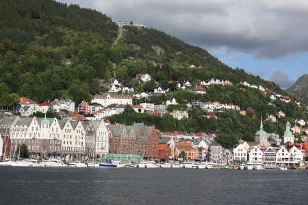 BERGEN, NORWAY - CIRCA JULY 2012: Tourists and locals stroll along the UNESCO World Heritage Site, Bryggen, July 2012 in Bergen. Bergen is the second largest city in Norway Population (2013) - 268,700のeditorial素材