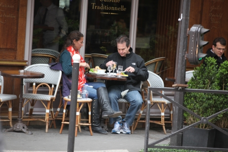 PARIS - APRIL 27 : Parisians and tourist enjoy eat and drinks in cafe sidewalk in Paris, France on April 27, 2013. Paris is one of the most populated metropolitan areas in Europeのeditorial素材