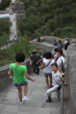 BEIJING - JUNE 12: Visitors walks on the Great Wall of China on June 12 2012. Four million people visits the great wall each year. The Great Wall of China is the longest man-made structure in the worldのeditorial素材