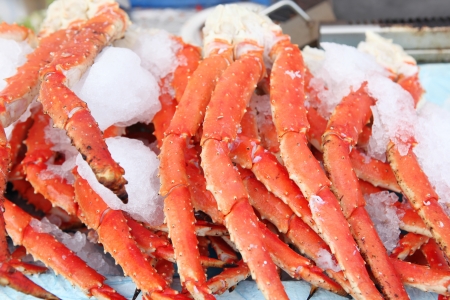 Fresh crab legs at a seafood marketの写真素材