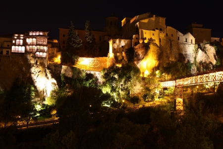 Night view on rocky river bank Jucar and bridge in Cuenca. Castilla-La Mancha, Spainのeditorial素材
