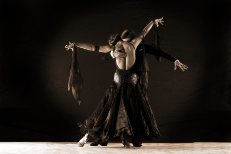 Latino dancers in ballroom isolated on blackの写真素材