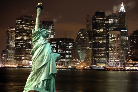 Statue of Liberty against night New York city, USAの写真素材