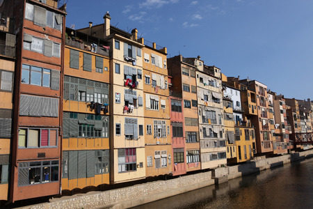 View of the old town with colorful houses reflected in water Jewish quarter in Girona. Catalonia. Spainのeditorial素材