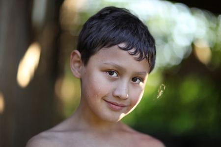 boy against summer backgriundの写真素材