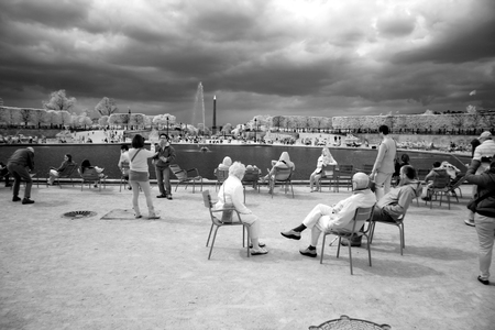 PARIS - APRIL 24: Local and Tourist in the famous Tuileries garden on April 24, 2012 in Paris. Tuileries Garden is a public garden located between the Louvre Museum and the Place de la Concorde and very popular sitteのeditorial素材