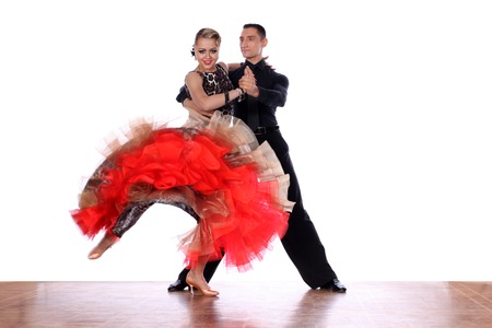 Latino dancers in ballroom against white backgroundの写真素材