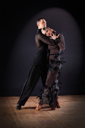 dancers in ballroom isolated on black backgroundの写真素材