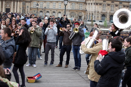 PARIS - APRIL 27: Unidentified musician play before public outdoors on April 27, 2013 in Paris, France. Everyday more 100 buskers perform on the streets and in the metro of Parisのeditorial素材