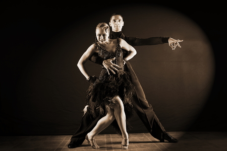 dancers in ballroom isolated on black backgroundの写真素材