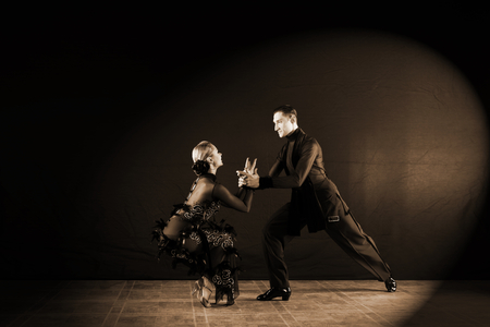 Dancers in ballroom isolated on black backgroundの写真素材