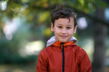 little happy boy outdoors in autumnの写真素材