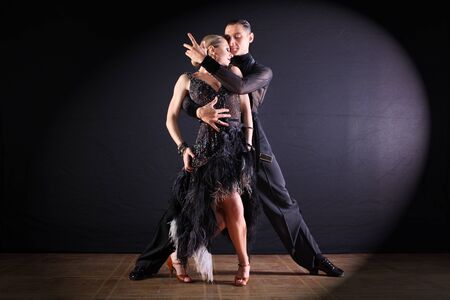 dancers in ballroom isolated on black background