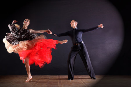 Dancers in ballroom isolated on black backgroundの写真素材